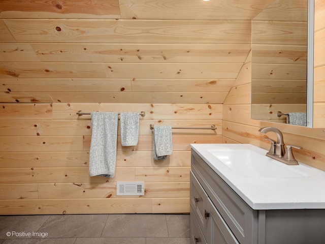 11 S Catherine Ave, La Grange, IL 60525 - bathroom with vanity, wooden walls, tile patterned floors, and lofted ceiling