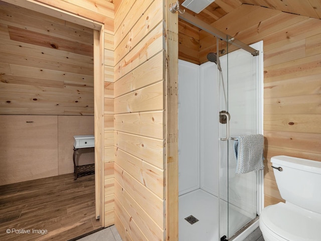 11 S Catherine Ave, La Grange, IL 60525 - bathroom with toilet, wooden walls, a shower stall, and wood finished floors