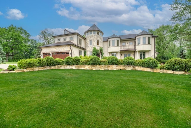 22W305 Broker Rd, Medinah, IL 60157 - view of front of home with a balcony, a front lawn, a garage, and stone siding