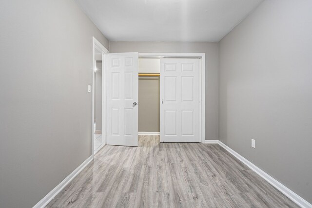 5343 S Long Ave Unit 5, Chicago, IL 60638 - unfurnished bedroom featuring light wood-style floors, baseboards, and a closet