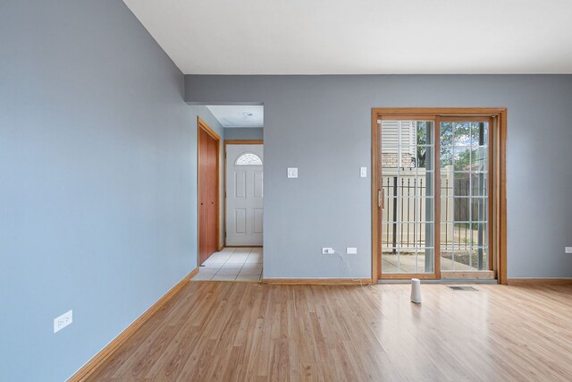 5343 S Long Ave Unit 5, Chicago, IL 60638 - empty room with light wood finished floors and baseboards
