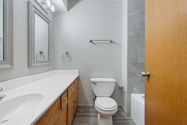 5343 S Long Ave Unit 5, Chicago, IL 60638 - full bathroom with vanity, toilet, wood finished floors, and baseboards