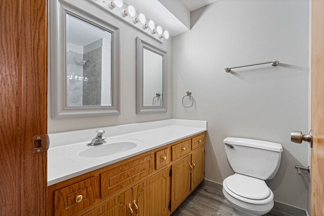 5343 S Long Ave Unit 5, Chicago, IL 60638 - full bath with toilet, vanity, wood finished floors, and baseboards