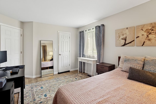 54 Brookston Dr Unit A1, Schaumburg, IL 60193 - bedroom with light wood-style floors and baseboards