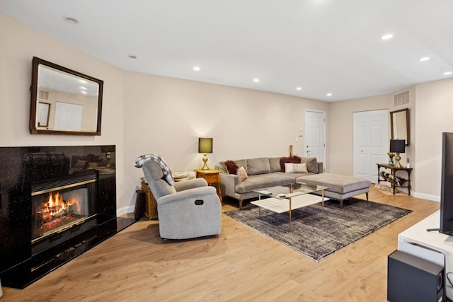 54 Brookston Dr Unit A1, Schaumburg, IL 60193 - living room featuring wood finished floors, a high end fireplace, recessed lighting, and baseboards