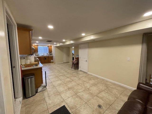 1507 N Ridgeway Ave, Champaign, IL 61821 - kitchen with recessed lighting, light countertops, light tile patterned flooring, open floor plan, and brown cabinets
