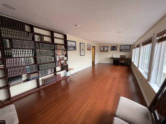 1507 N Ridgeway Ave, Champaign, IL 61821 - unfurnished living room with wood finished floors, a desk, and recessed lighting