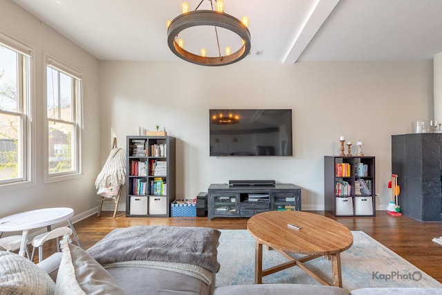 2044 W Roscoe St Unit 2S, Chicago, IL 60618 - living room featuring healthy amount of natural light, a chandelier, and wood finished floors