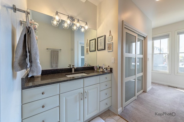 2044 W Roscoe St Unit 2S, Chicago, IL 60618 - bathroom with baseboards and vanity