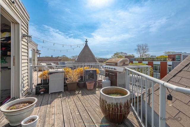 2044 W Roscoe St Unit 2S, Chicago, IL 60618 - wooden deck featuring a grill