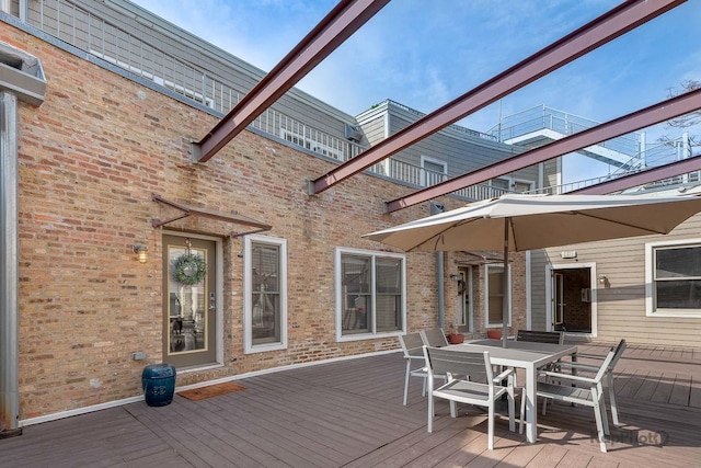 2044 W Roscoe St Unit 2S, Chicago, IL 60618 - wooden deck with outdoor dining space