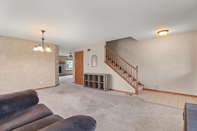 1129 S Wabena Ave, Minooka, IL 60447 - carpeted living room featuring stairs, a chandelier, baseboards, and a fireplace with raised hearth