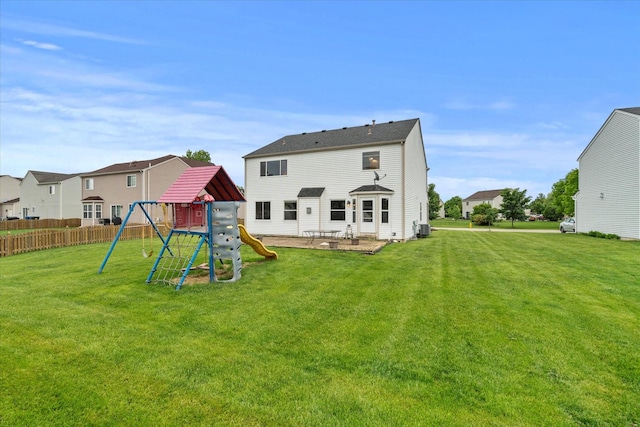 1129 S Wabena Ave, Minooka, IL 60447 - rear view of property with a playground, a patio, and central AC
