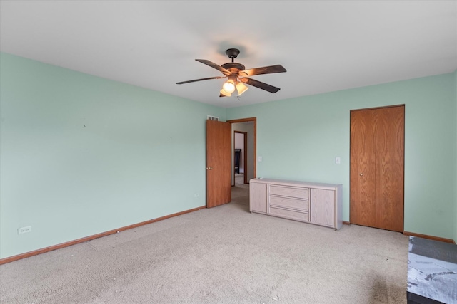 1129 S Wabena Ave, Minooka, IL 60447 - unfurnished bedroom with carpet floors, baseboards, and ceiling fan