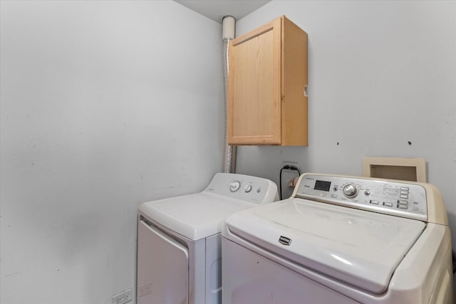 1129 S Wabena Ave, Minooka, IL 60447 - laundry area featuring cabinet space and washing machine and clothes dryer