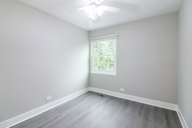 1914 Brookside Ln, Hoffman Estates, IL 60169 - unfurnished room with baseboards, dark wood-type flooring, and ceiling fan