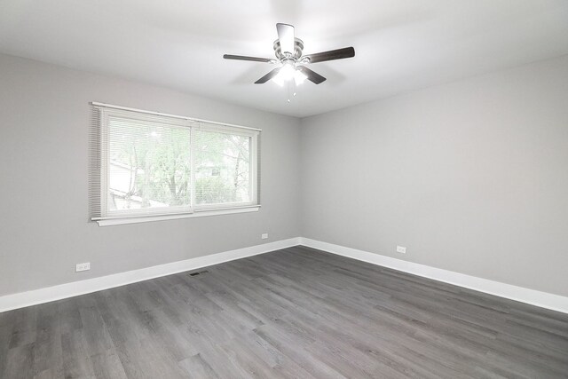 1914 Brookside Ln, Hoffman Estates, IL 60169 - empty room with dark wood finished floors, baseboards, and a ceiling fan