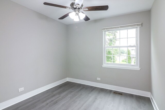 1914 Brookside Ln, Hoffman Estates, IL 60169 - unfurnished room featuring baseboards, dark wood-style flooring, and a ceiling fan