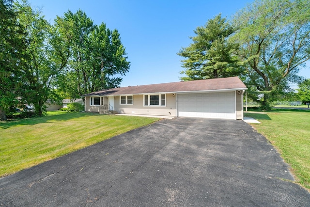 341 Cardinal Ln, Lake Holiday, IL 60552 - ranch-style house featuring a garage, asphalt driveway, and a front yard