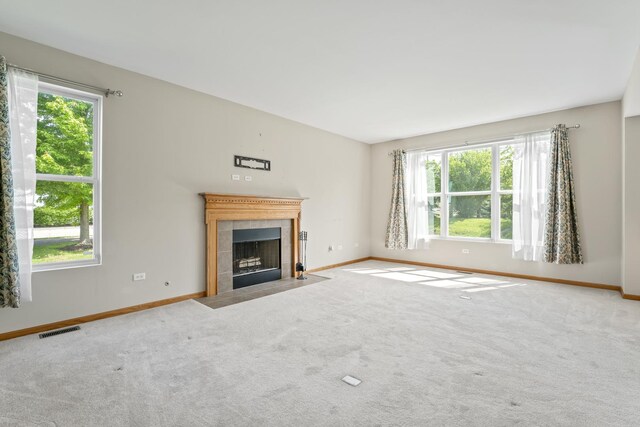 3816 Stockton Dr, Joliet, IL 60436 - unfurnished living room featuring a fireplace, baseboards, and carpet floors