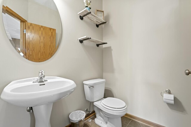 3816 Stockton Dr, Joliet, IL 60436 - bathroom featuring toilet, baseboards, and tile patterned floors