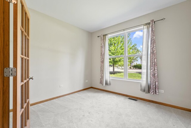 3816 Stockton Dr, Joliet, IL 60436 - spare room with light colored carpet and baseboards