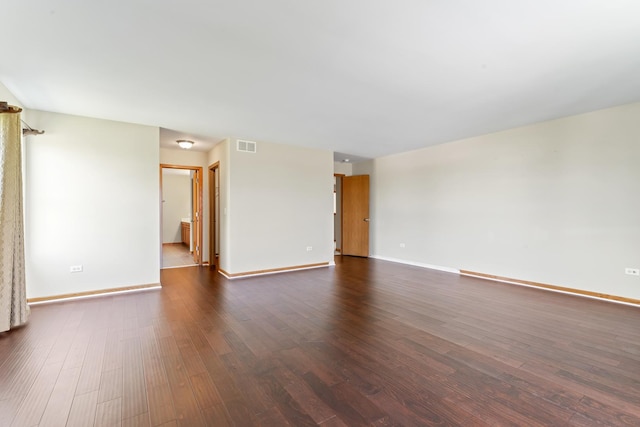 3816 Stockton Dr, Joliet, IL 60436 - empty room featuring dark wood-style flooring and baseboards