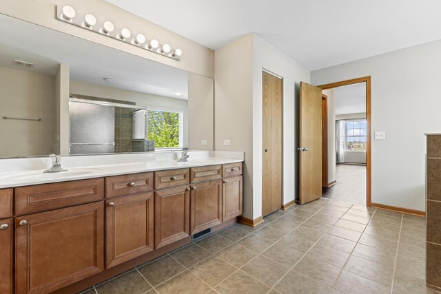3816 Stockton Dr, Joliet, IL 60436 - full bathroom featuring double vanity, a stall shower, baseboards, and tile patterned floors