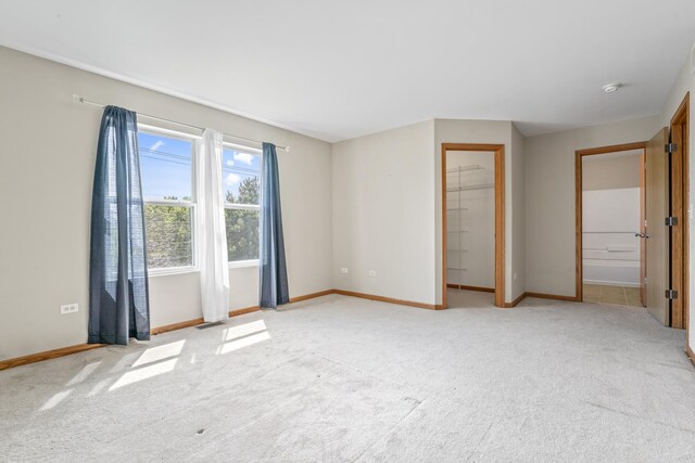 3816 Stockton Dr, Joliet, IL 60436 - unfurnished bedroom featuring light colored carpet and baseboards
