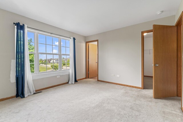 3816 Stockton Dr, Joliet, IL 60436 - spare room with light carpet, baseboards, and a smoke detector