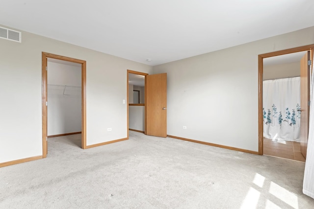 3816 Stockton Dr, Joliet, IL 60436 - unfurnished bedroom with light carpet, a spacious closet, baseboards, and a closet