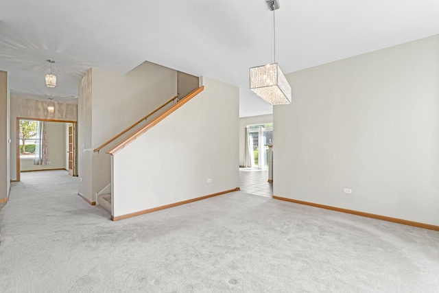 3816 Stockton Dr, Joliet, IL 60436 - unfurnished living room with carpet floors, baseboards, and stairway