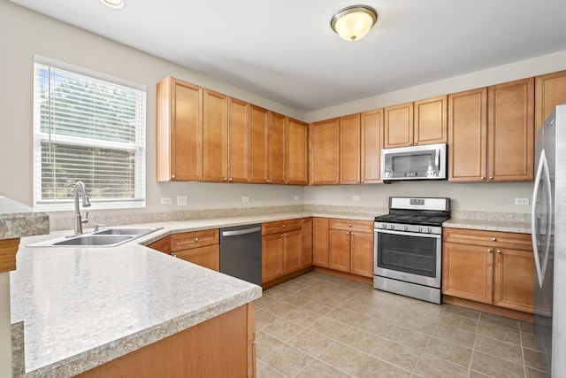3816 Stockton Dr, Joliet, IL 60436 - kitchen featuring appliances with stainless steel finishes, a sink, light countertops, light tile patterned flooring, and recessed lighting