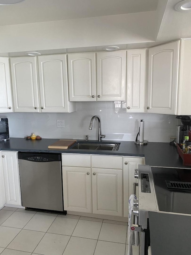 6007 N Sheridan Rd Unit 31A, Chicago, IL 60660 - kitchen with appliances with stainless steel finishes, a sink, white cabinetry, dark countertops, and light tile patterned floors