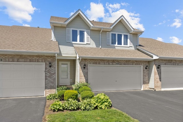 816 Adam Ln, Hampshire, IL 60140 - townhome / multi-family property with brick siding, a shingled roof, and asphalt driveway