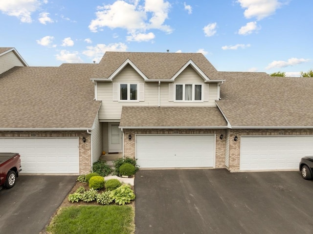 816 Adam Ln, Hampshire, IL 60140 - view of front of home with driveway, brick siding, and a shingled roof