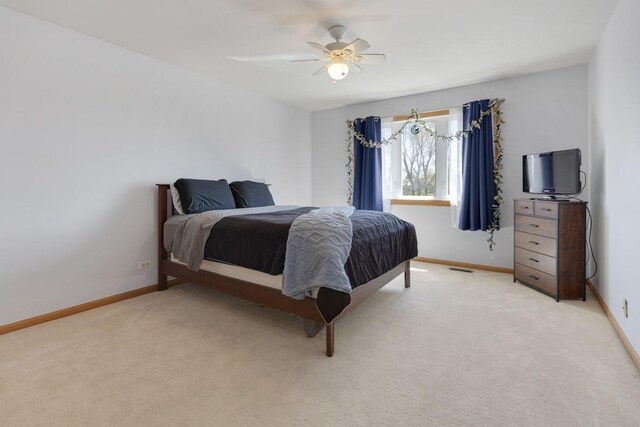 816 Adam Ln, Hampshire, IL 60140 - bedroom featuring baseboards, light carpet, and a ceiling fan