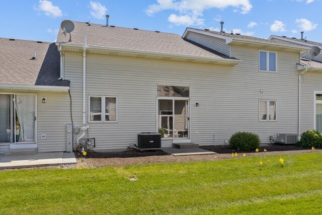 816 Adam Ln, Hampshire, IL 60140 - rear view of house featuring central AC unit, a lawn, and a shingled roof
