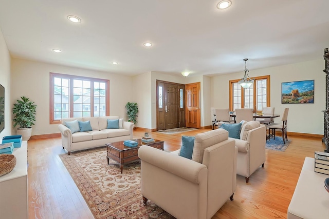 5352 N Neva Ave, Chicago, IL 60656 - living area featuring plenty of natural light, light wood-style floors, and recessed lighting