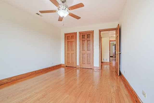 5352 N Neva Ave, Chicago, IL 60656 - unfurnished bedroom with light wood-type flooring, baseboards, and a ceiling fan