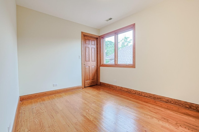 5352 N Neva Ave, Chicago, IL 60656 - empty room with light wood-style floors and baseboards