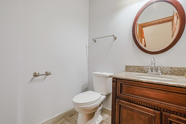 5352 N Neva Ave, Chicago, IL 60656 - half bathroom with toilet, vanity, and baseboards
