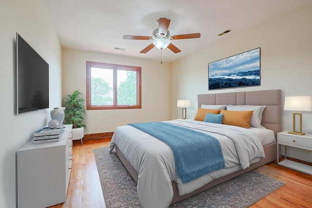 5352 N Neva Ave, Chicago, IL 60656 - bedroom with light wood-style floors, baseboards, and a ceiling fan
