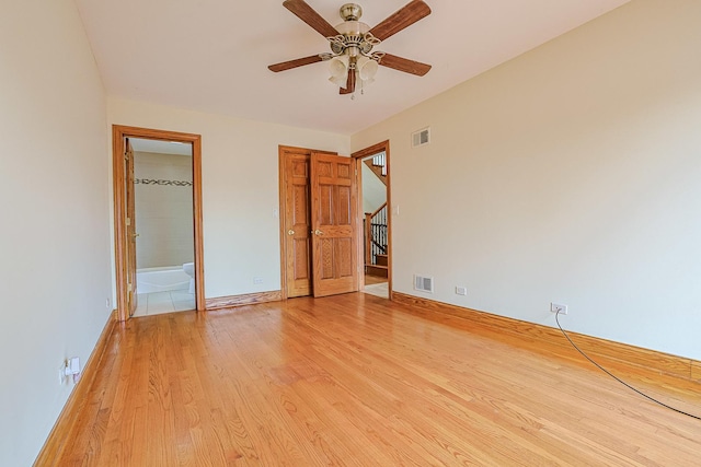 5352 N Neva Ave, Chicago, IL 60656 - unfurnished bedroom featuring light wood finished floors, baseboards, and ensuite bath