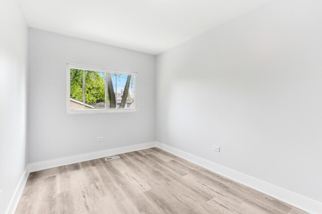 337 W 106th Pl, Chicago, IL 60628 - spare room with light wood-style flooring and baseboards