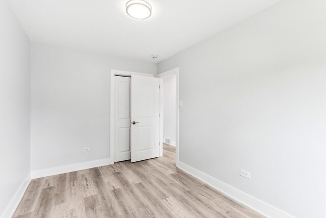 337 W 106th Pl, Chicago, IL 60628 - spare room featuring light wood-style flooring and baseboards