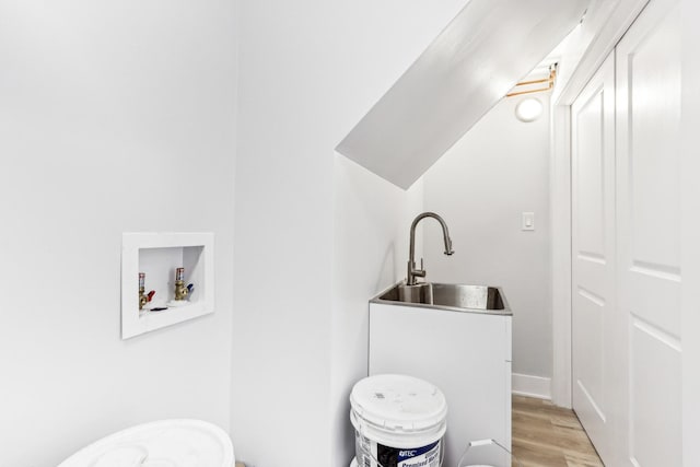 337 W 106th Pl, Chicago, IL 60628 - bathroom featuring a sink and wood finished floors