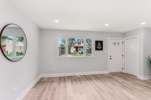 337 W 106th Pl, Chicago, IL 60628 - entryway with light wood-style floors, baseboards, and recessed lighting