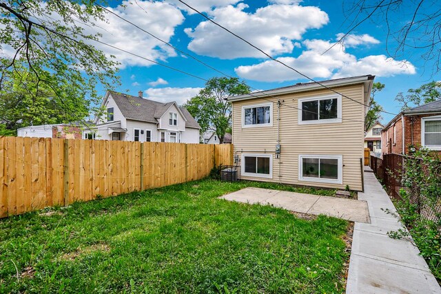 337 W 106th Pl, Chicago, IL 60628 - rear view of house featuring cooling unit and a patio area