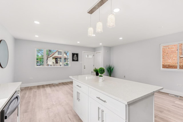 337 W 106th Pl, Chicago, IL 60628 - kitchen with dishwasher, light wood-style floors, hanging light fixtures, white cabinets, and baseboards